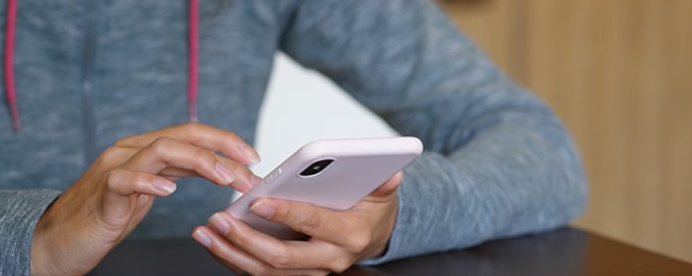 Woman use of smart phone at home